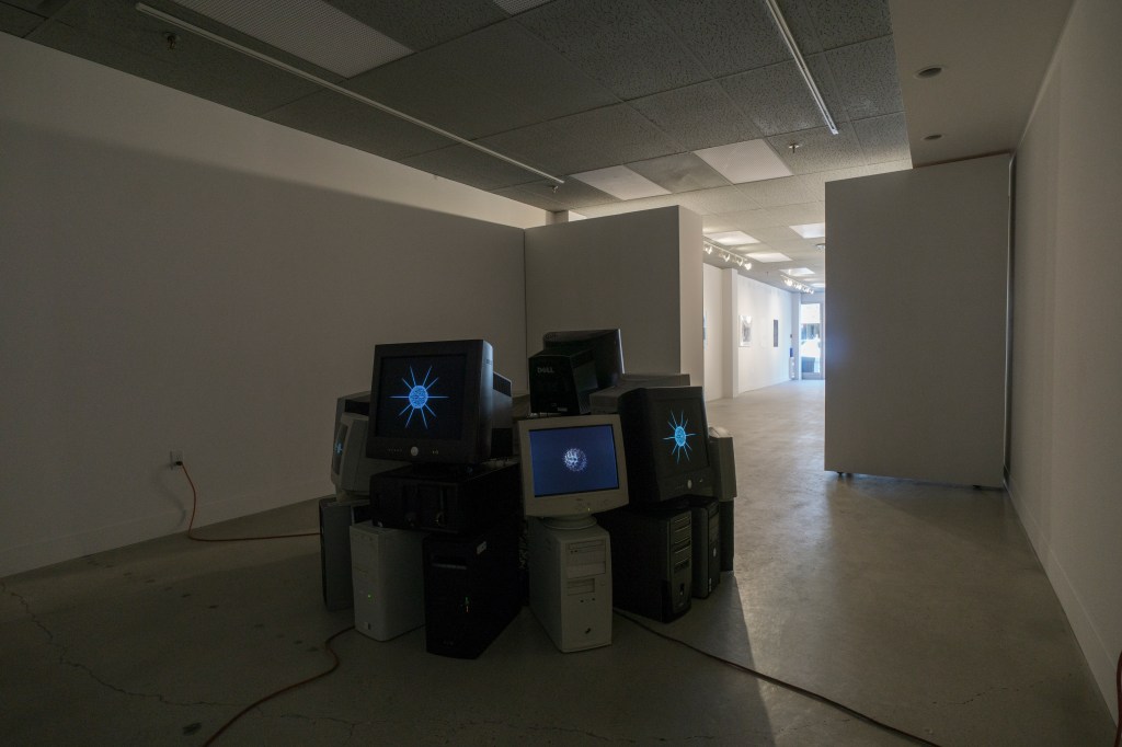 computer monitors arranged in circle